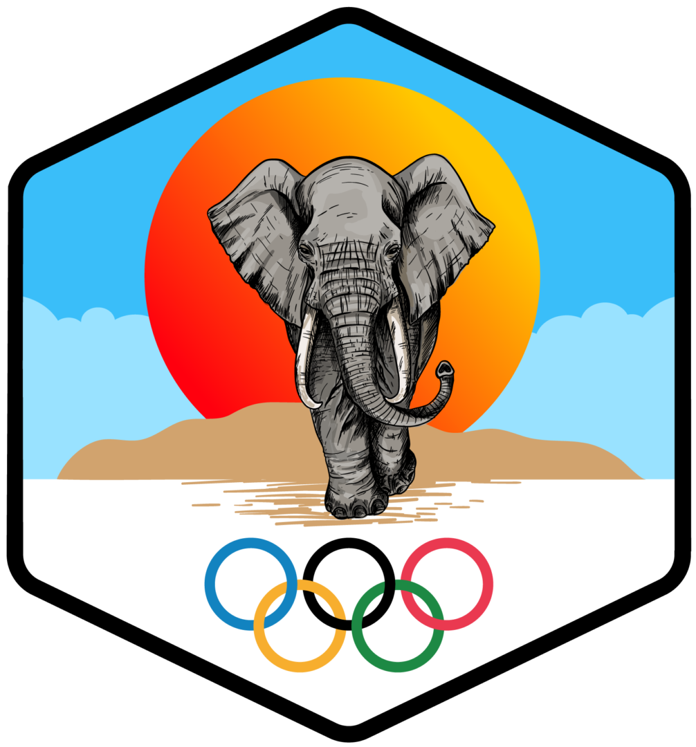 An elephant walking across a beach with olympic rings in the background.